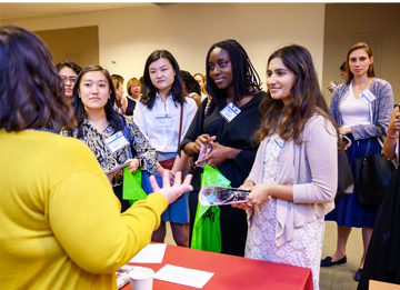 Women talking at an expo table
