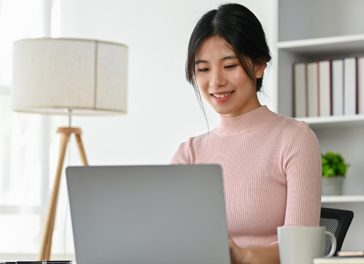Woman sitting at laptop computer