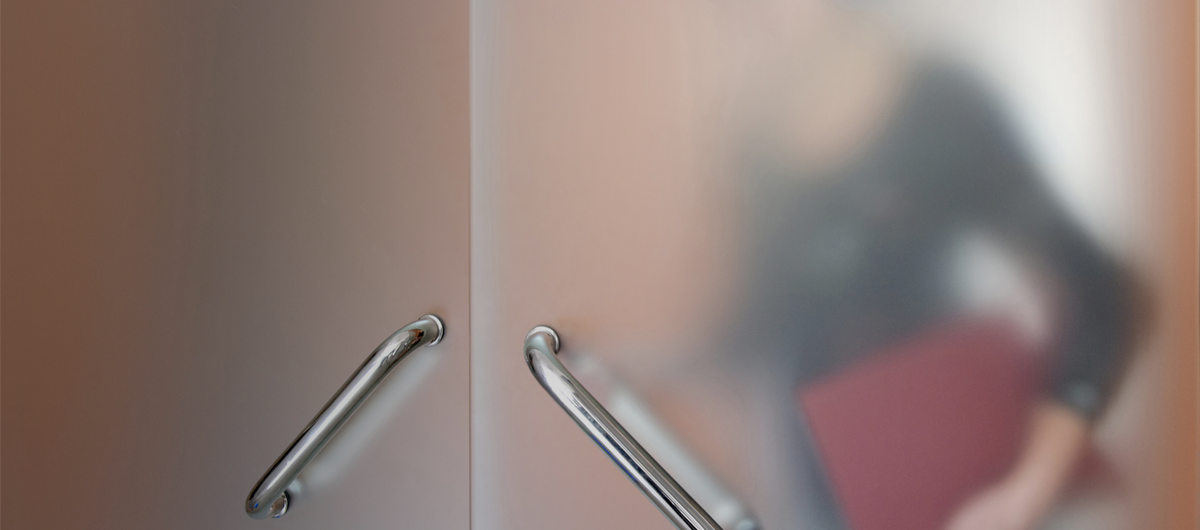 Woman walking through a door
